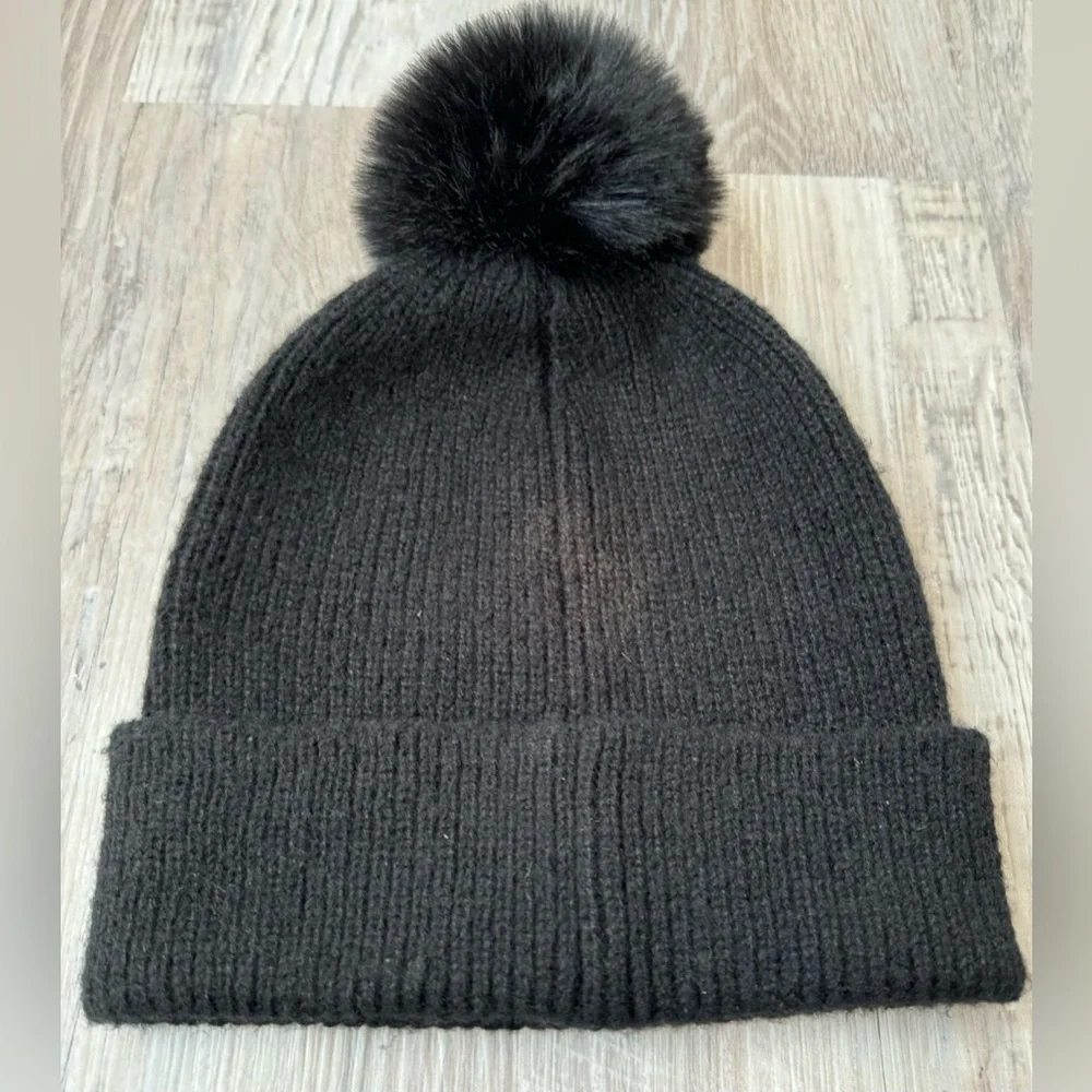 Madden NYC women’s beanie hat with decorative trim and pom-pom. Excellent condi
